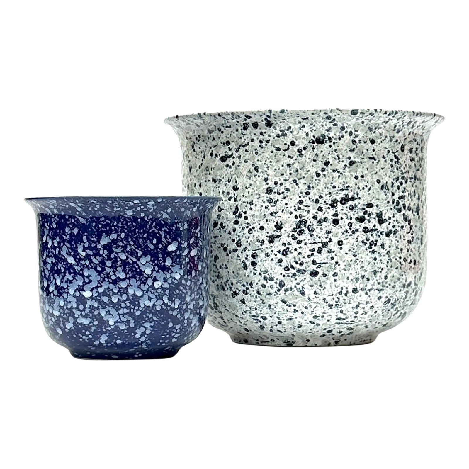 Elegantly Shaped Blue & White Ceramic Splatterware Planter Curation, Made in Germany - Group of 2: Blue and white ceramic planters, group of 2. This set of funky 1970s splatterware navy blue and white planters features a splatter glaze style. Made in West Germany. Shortest: 4.5"H x 5.5"W Tallest: