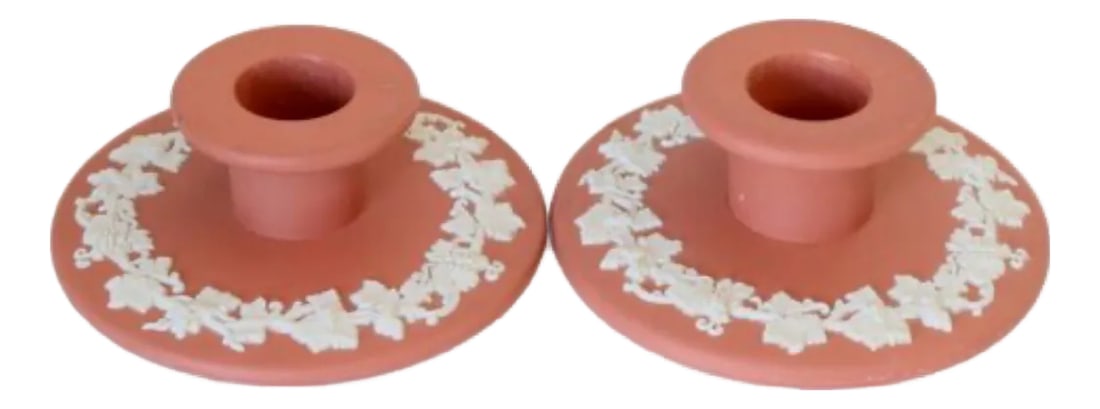 1950s Wedgwood Jasperware Candlesticks- a Pair: Pair of English Wedgwood Jasperware candlesticks in rare terra cotta and cream coloration. Dated 1957 on base. Features classical bas-relief scenes in crisp white against a matte ceramic field. A