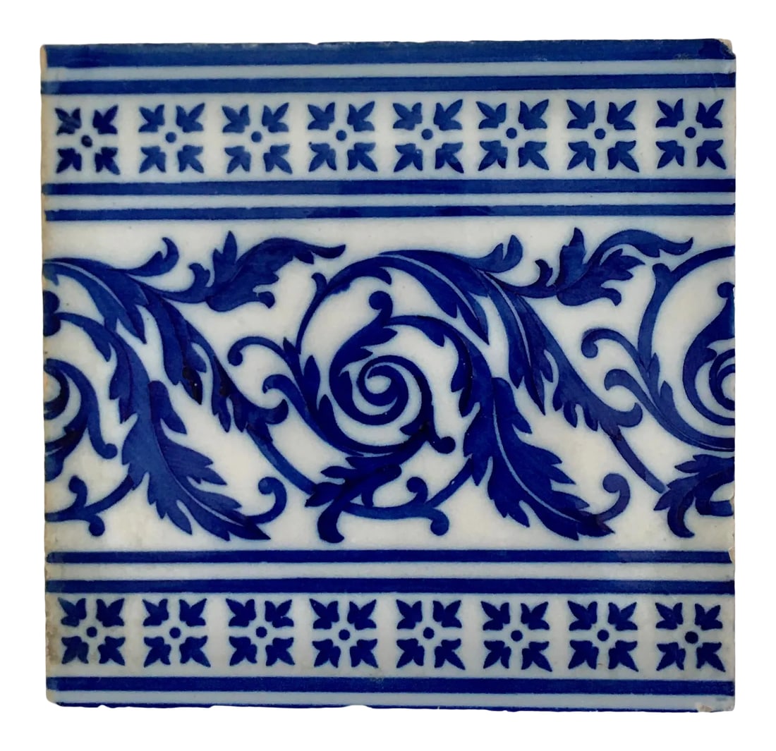 Antique Blue and White Spanish Tile: Early 20th century reclaimed Spanish tile in vibrant blue and white. Condition: Alterations: Original Condition Unaltered Imperfections: Some Imperfections Condition Notes: Tile is in reclaimed condit