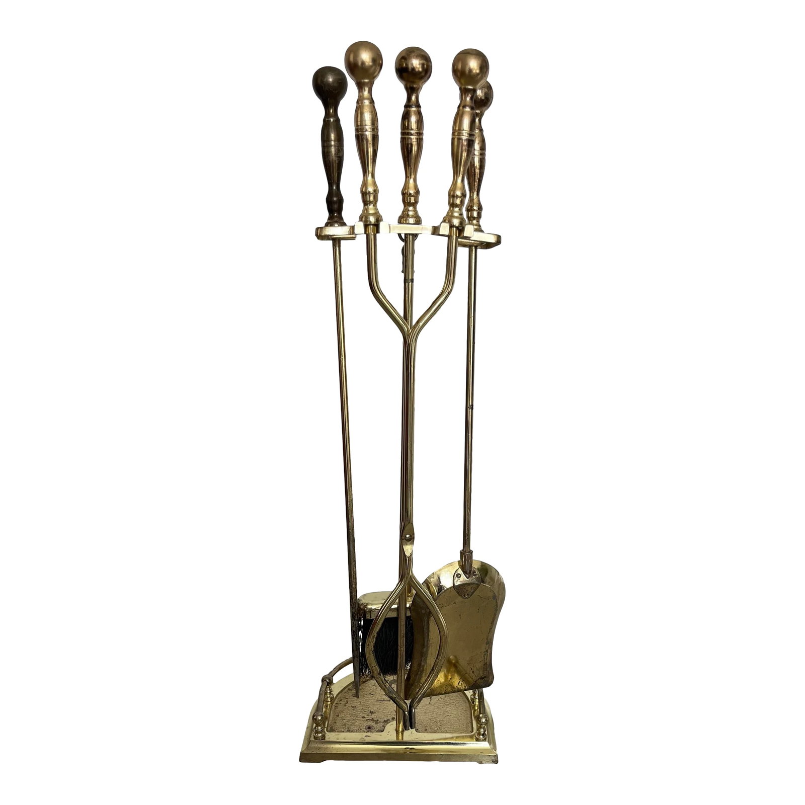 Vintage Neoclassical Metal Fire Tools-5 Piece Set: Late 20th Century Set of Neo-Classical Brass Finish Fireplace Toos in a Stand. The set includes an ash shovel, tongs, a poker, and broom and the stand. Condition: Alterations: Original Condition