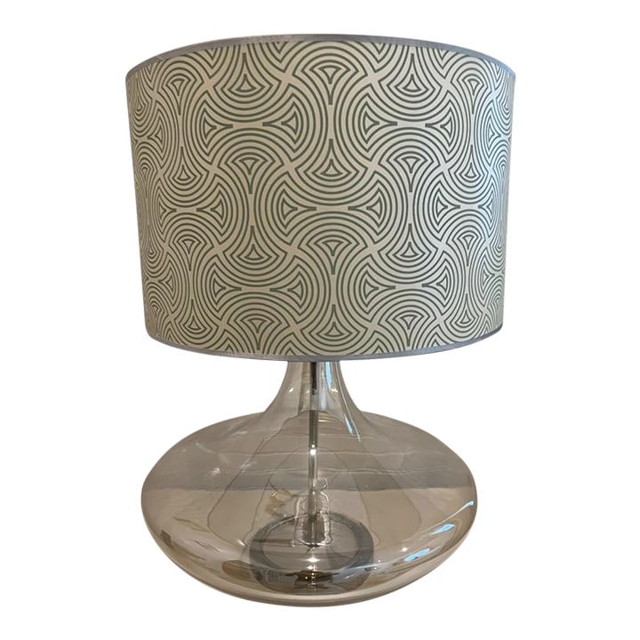 Oversized Mid-Century Modern Glass Lamp With Patterned Drum Shade, 1960s-1970s: Oversized mid-century modern lamp with a sculptural blown-glass base and bold patterned drum shade. Dating from the 1960s-1970s, this lamp makes a true statement piece, combining sleek glass with retr