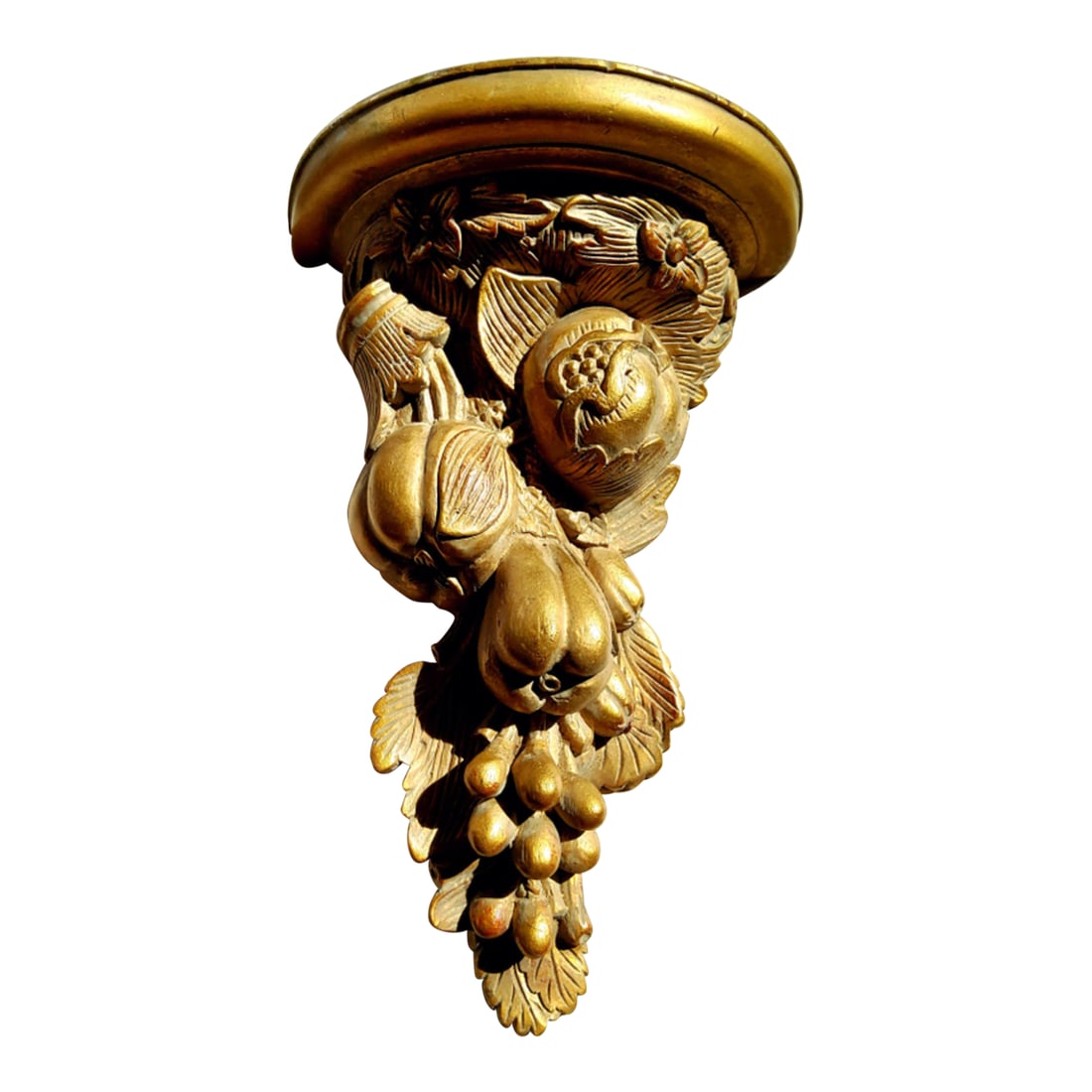 1960s Carved Wood Gilt Sconce Shelf With Fruit 12": This detailed carved wood sconce shelf is a cornucopia of fruits including a grape bunch with leaves and pomegranates. The soft gold finish gives the piece an elegance that will showcase any