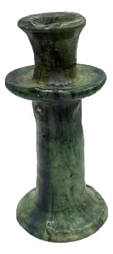 Moroccan Tamegroute Glazed Candlestick Holder: A Moroccan Tamegroute glazed candlestick holder is a handcrafted piece made in the historic pottery village of Tamegroute in southern Morocco. These holders are shaped from local clay and finished