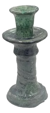 Moroccan Tamegroute Glazed Candlestick Holder: A Moroccan Tamegroute glazed candlestick holder is a handcrafted piece made in the historic pottery village of Tamegroute in southern Morocco. These holders are shaped from local clay and finished