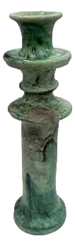 Moroccan Tamegroute Glazed Candlestick Holder: A Moroccan Tamegroute glazed candlestick holder is a handcrafted piece made in the historic pottery village of Tamegroute in southern Morocco. These holders are shaped from local clay and finished