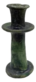 1970s Moroccan Tamegroute Glazed Candlestick Holder: A Moroccan Tamegroute glazed candlestick holder is a handcrafted piece made in the historic pottery village of Tamegroute in southern Morocco. These holders are shaped from local clay and finished