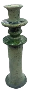 Moroccan Tamegroute Glazed Candlestick Holder: A Moroccan Tamegroute glazed candlestick holder is a handcrafted piece made in the historic pottery village of Tamegroute in southern Morocco. These holders are shaped from local clay and finished