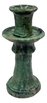 Moroccan Tamegroute Glazed Candlestick Holder: A Moroccan Tamegroute glazed candlestick holder is a handcrafted piece made in the historic pottery village of Tamegroute in southern Morocco. These holders are shaped from local clay and finished