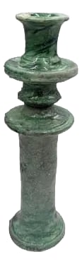 Moroccan Tamegroute Glazed Candlestick Holder: A Moroccan Tamegroute glazed candlestick holder is a handcrafted piece made in the historic pottery village of Tamegroute in southern Morocco. These holders are shaped from local clay and finished