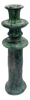 Moroccan Tamegroute Glazed Candlestick Holder: A Moroccan Tamegroute glazed candlestick holder is a handcrafted piece made in the historic pottery village of Tamegroute in southern Morocco. These holders are shaped from local clay and finished
