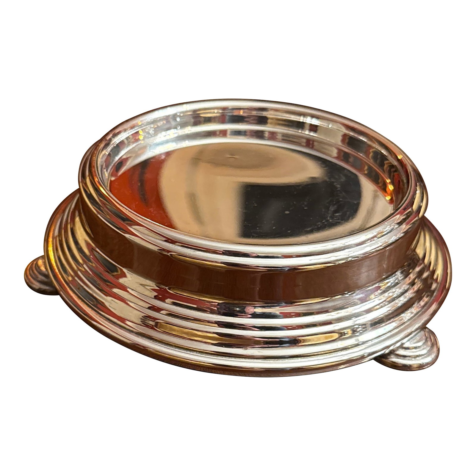Silverplated Display Stand or Bowl Stand: Mid Century Silver Plate Riser pedestal stand for a bowl, jar, or candle. Concentric ribbed design, standing on 3 feet with similar design. Interior will hold up to 5" Condition: Alterations: