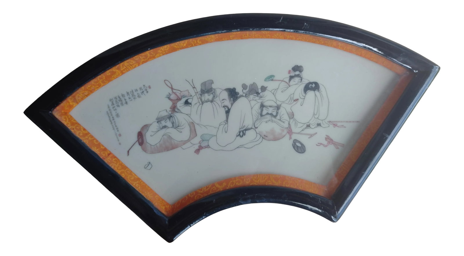 Vintage Chinese Traditional Scene on Ceramic Fan: These men are huddled together on the ground in a traditional Chinese or Asian scene. The Chinese script accompanying the scene is photographed up close so it may be read. The scene is on a ceramic fa