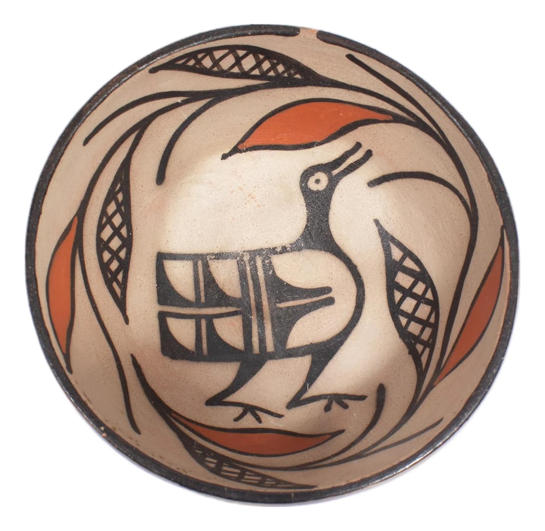 Signed 2008 Santo Domingo Pueblo Pottery Bowl With Bird by Ione Coriz: A pottery bowl by the Santa Domingo pueblo potter Ione Coriz. Signed and dated 2008 to the underside, the bowl has a black, tan, and orange design depicting a stylized bird surrounded by vining