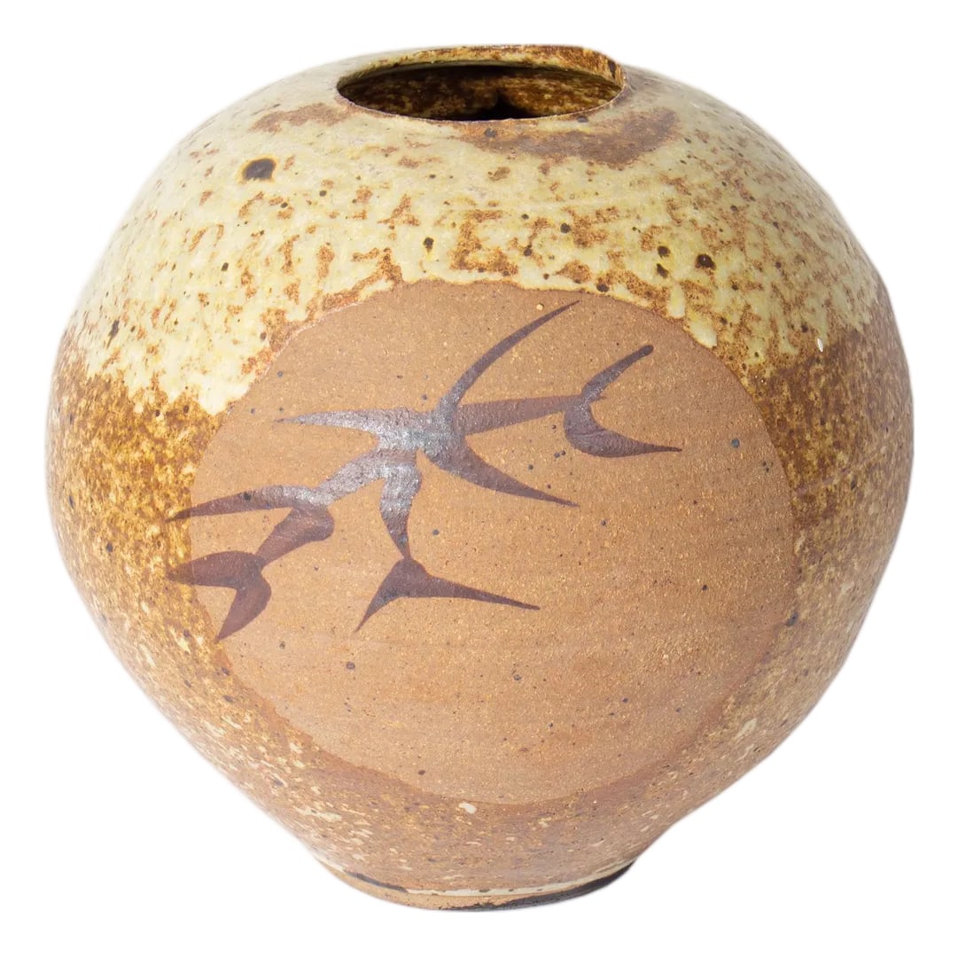 Tariki Studio Pottery Vase by Jack O'Leary: A studio pottery vase by American ceramicist Jack O'Leary (1918-1981) of Tariki Studio. In several shades of brown and tan, this vase features a circle on the front with an abstract design. It is