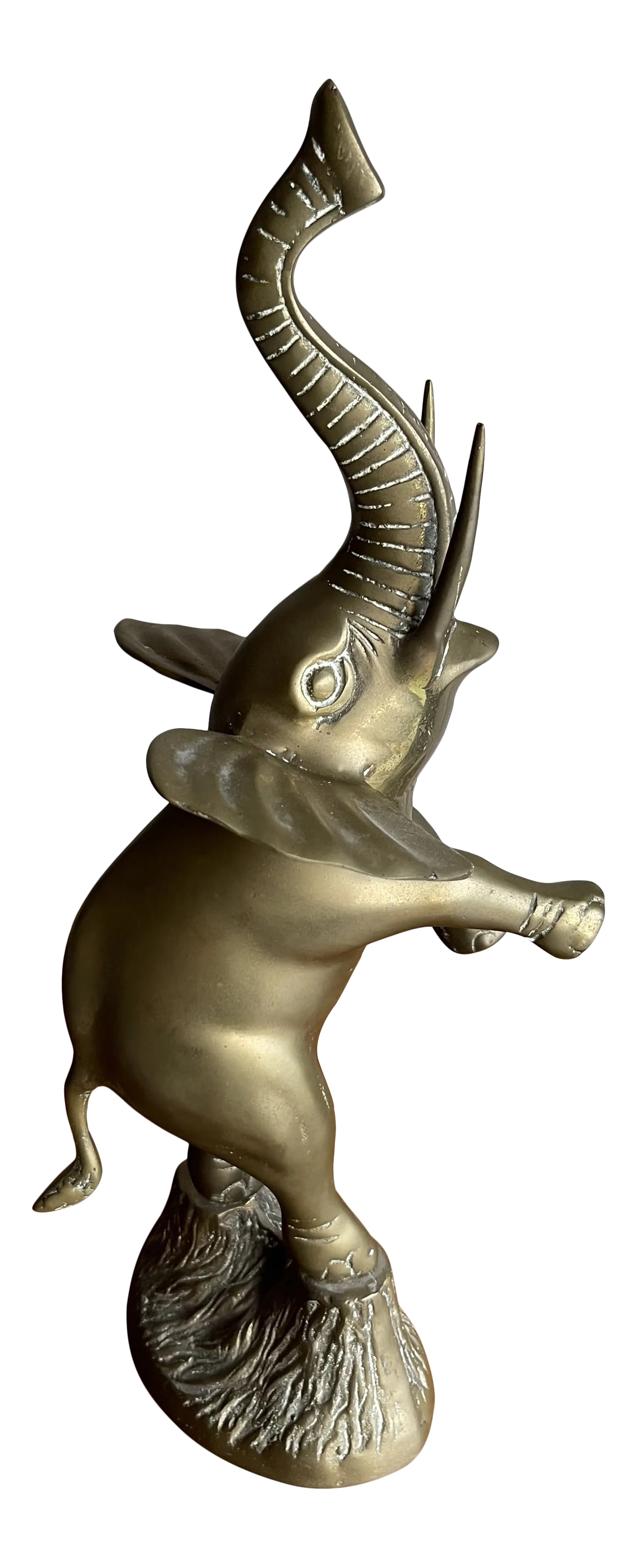 Vintage Mid 20th Century Standing Brass Elephant Figurine or Sculpture: A beautiful vintage figurine brass elephant born in Korea circa 1960. Standing on top of a pedestal this pachyderm reaches 18" tall from base to the tip of the trunk. Elephant statues with their