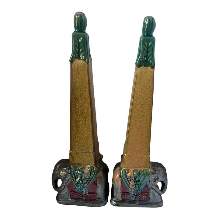 Pair 1930s Art Deco Egyptian Revival Elephant Obelisk Sculptures / Architectural Ceramic Bookends -: A striking pair of tall Art Deco ceramic sculptures featuring stylized obelisk forms rising from sculptural elephant bases. The design reflects the Egyptian Revival aesthetic popular in the 1920s-1930