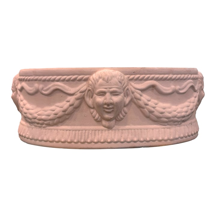 Vintage Neoclassical Terracotta Planter With Classical Faces: Vintage Neoclassical Terracotta Planter With Classical Faces A charming vintage terracotta planter with classical face reliefs, swag detail, and a softly timeworn finish. This small neoclassical