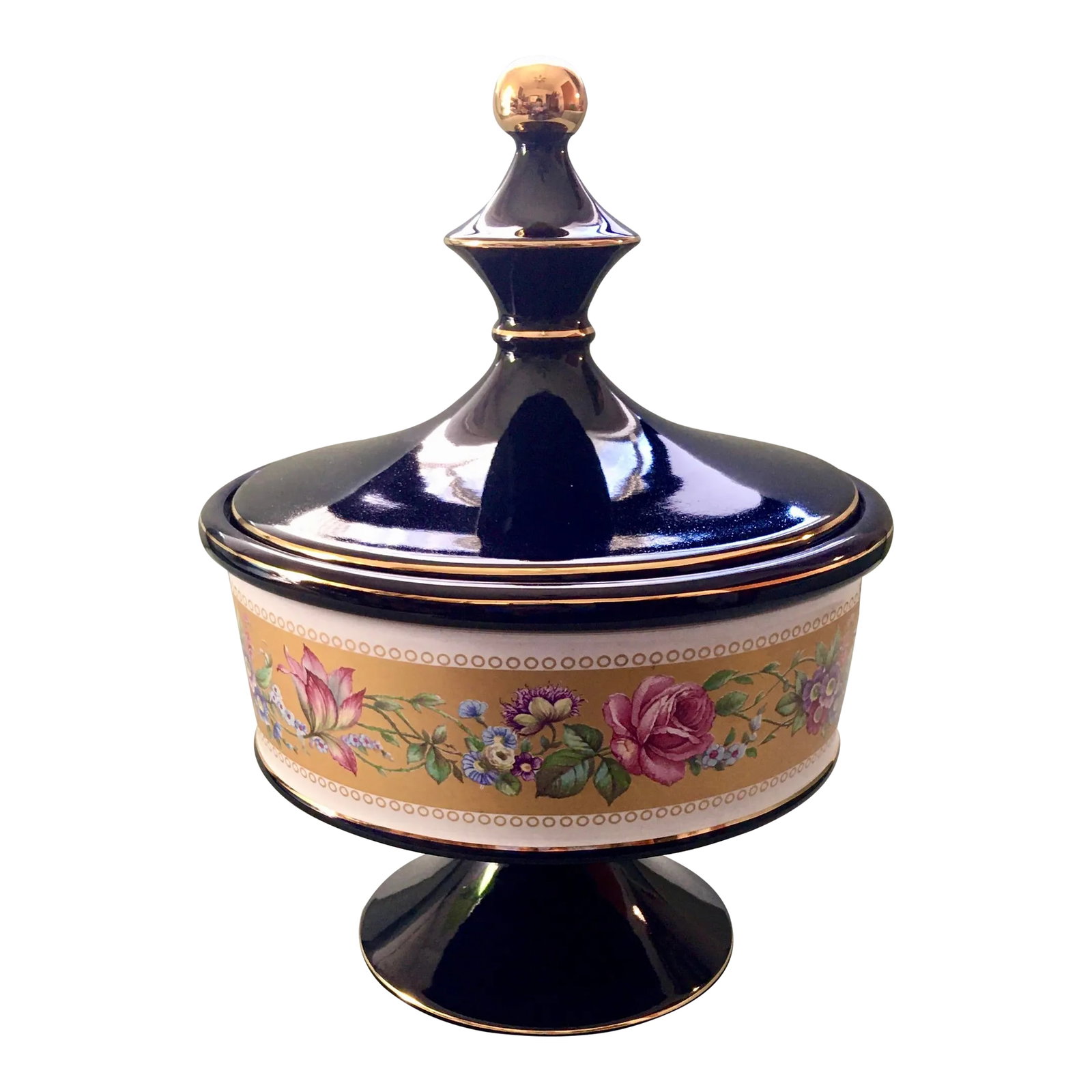 Italian Cobalt Blue Gold Floral Banded Footed Dish: A beautiful dark blue covered dish which features a band of intertwined flowers in shades of pink, blue and purple on a golden background with rows of gold circles edged in white. Ships within 1-2 day