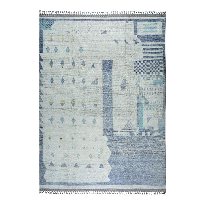 9x13 Gray Hand-Knotted Wool Deconstructed Skyline Tribal Modern Carpet Rug: This hand knotted pile rug features a primary gray color palette and is crafted from durable wool. The construction reflects the traditional techniques used in Berber carpet styles, originating from s