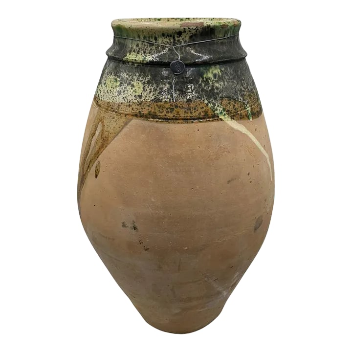 Vintage Turkish Terracotta Oil Jar: Hailing from the mountains of Anatolia and Konya in Turkey, these oil jars have a very transitional appeal. Each one is so wonderfully unique with its glaze and terra cotta color. You are buying a