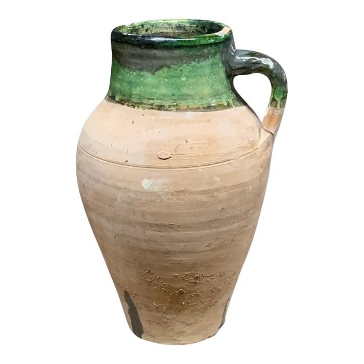 Vintage Turkish Terracotta Oil Jar: Hailing from the mountains of Anatolia and Konya in Turkey, these oil jars have a very transitional appeal. Each one is so wonderfully unique with its glaze and terra cotta color. You are buying a