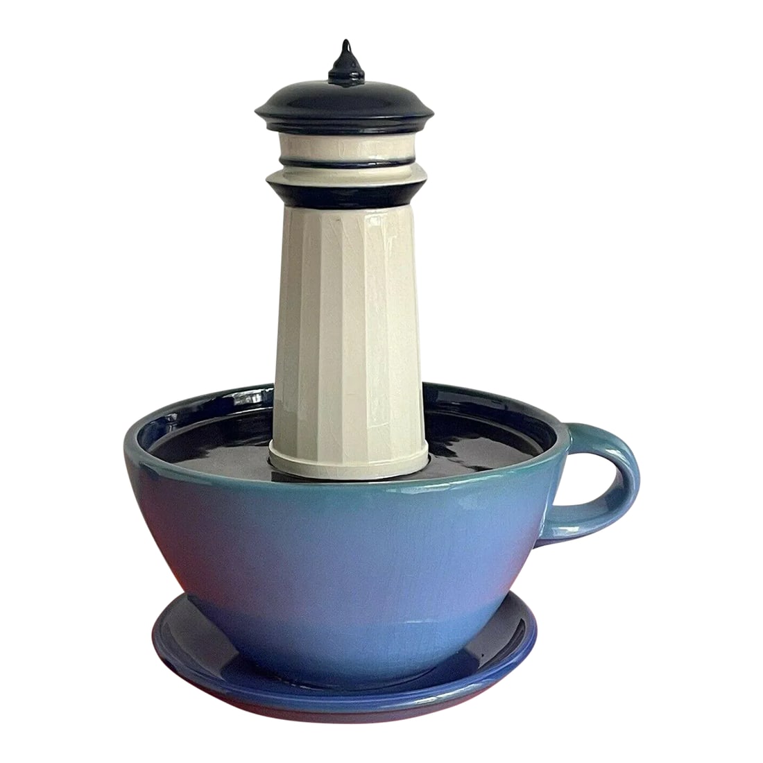 1994 Surrealist Studio Art Pottery Sculpture Lighthouse in a Coffee Cup: Surrealist Studio Art Pottery Sculpture depicting a Lighthouse floating in a Coffee Cup. An unique, whimsical ceramic piece signed by Will Herrera and dated 1994. Condition is overall excellent for