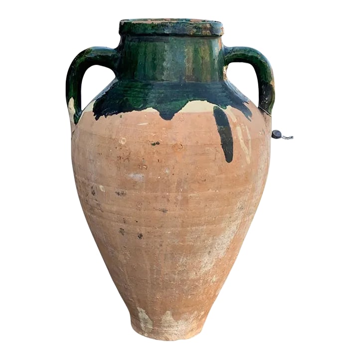 Vintage Turkish Terracotta Oil Jar: Hailing from the mountains of Anatolia and Konya in Turkey, these oil jars have a very transitional appeal. Each one is so wonderfully unique with its glaze and terra cotta color. You are buying a