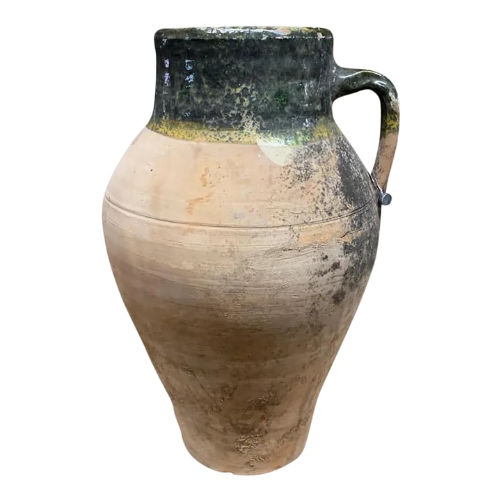 Vintage Turkish Terracotta Oil Jar: Hailing from the mountains of Anatolia and Konya in Turkey, these oil jars have a very transitional appeal. Each one is so wonderfully unique with its glaze and terra cotta color. You are buying a