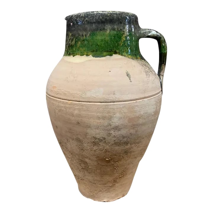 Vintage Turkish Terracotta Oil Jar: Hailing from the mountains of Anatolia and Konya in Turkey, these oil jars have a very transitional appeal. Each one is so wonderfully unique with its glaze and terra cotta color. You are buying a