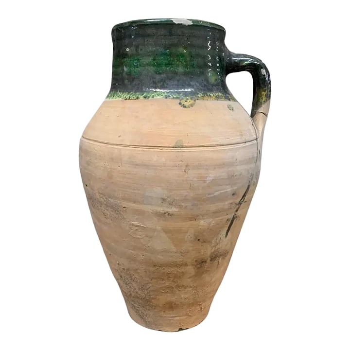 Vintage Turkish Terracotta Oil Jar: Hailing from the mountains of Anatolia and Konya in Turkey, these oil jars have a very transitional appeal. Each one is so wonderfully unique with its glaze and terra cotta color. You are buying a