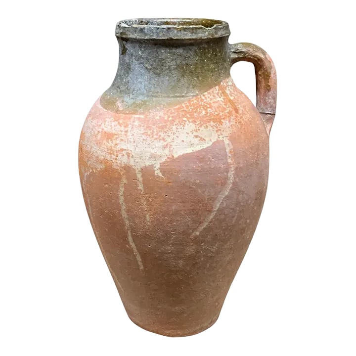 Vintage Turkish Terracotta Oil Jar: Hailing from the mountains of Anatolia and Konya in Turkey, these oil jars have a very transitional appeal. Each one is so wonderfully unique with its glaze and terra cotta color. You are buying a