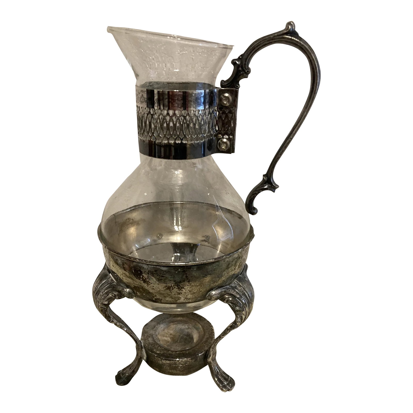 Vintage Glass Coffee Pot in Silver-Plate Holder: This vintage glass coffee pot is presented in an ornate silver-plate holder featuring scrolling legs and decorative handle. The removable glass vessel was designed for serving coffee or tea while the 