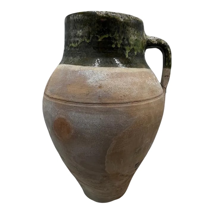 Vintage Turkish Terracotta Oil Jar: Hailing from the mountains of Anatolia and Konya in Turkey, these oil jars have a very transitional appeal. Each one is so wonderfully unique with its glaze and terra cotta color. You are buying a