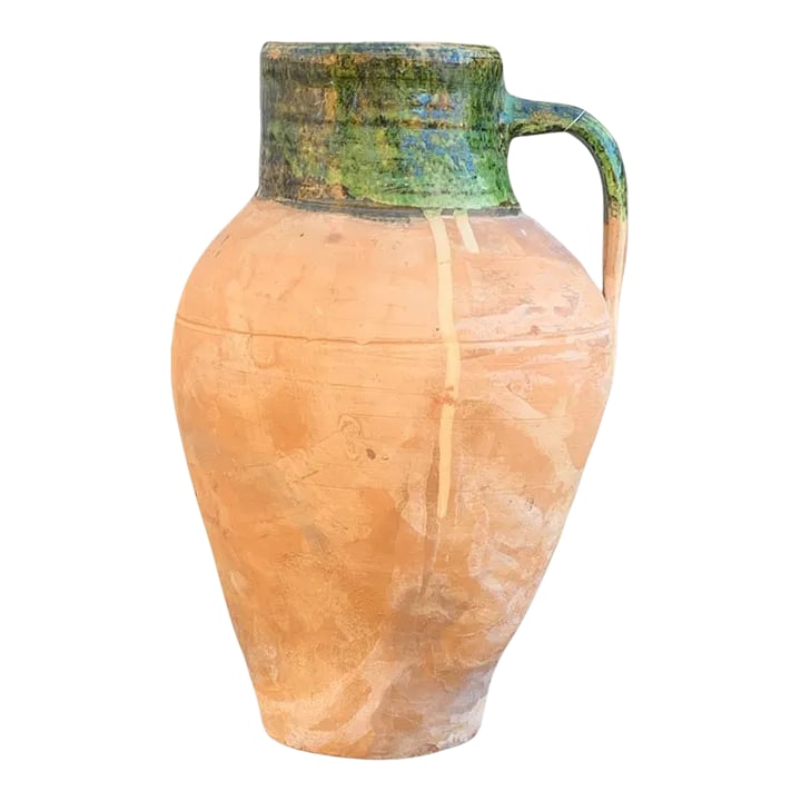 Vintage Turkish Terracotta Oil Jar: Hailing from the mountains of Anatolia and Konya in Turkey, these oil jars have a very transitional appeal. Each one is so wonderfully unique with its glaze and terra cotta color. You are buying a