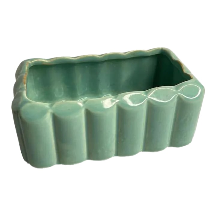 Vintage Blue McCoy Planter: Vintage light blue McCoy planter with a small chip and some wear along the inner rim. Signed on the base. Condition: Alterations: Original Condition Unaltered Imperfections: Some Imperfections