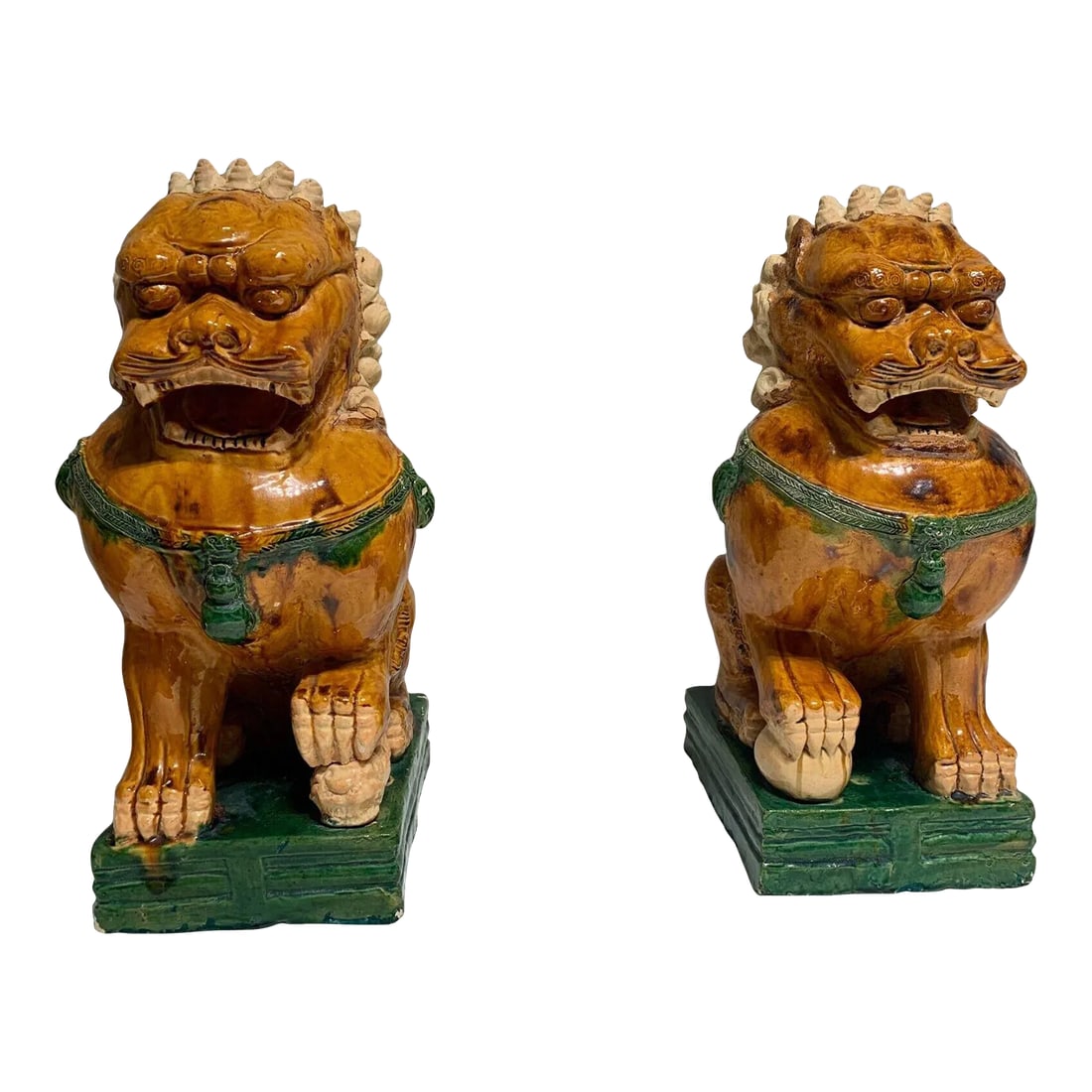 Antique Ceramic Glazed Pair of Foo Dogs: Purchased in 1970's from Sotheby's . A beautiful pair of food dogs made with glazed ceramic and great decorative pieces for indoor or outdoor. It is for sell as a pair. The pair is in great condition
