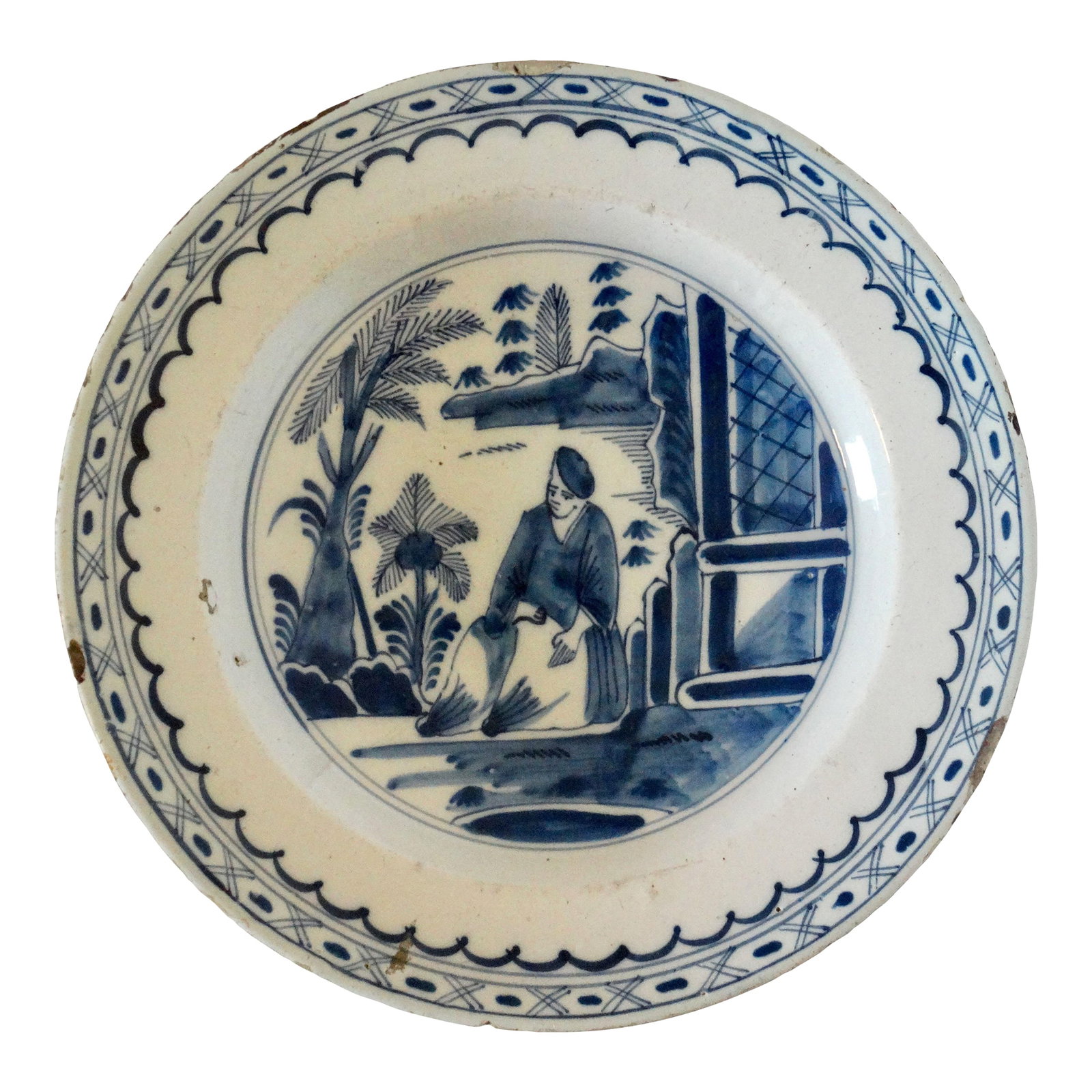 18th-Century English Figural Chinoiserie Charger Hand Painted: An 18th-Century English Delft chinoiserie charger with a figure in a landscape with trees, a building, and water. It is hand painted in the traditional cobalt blue and white. It has a double