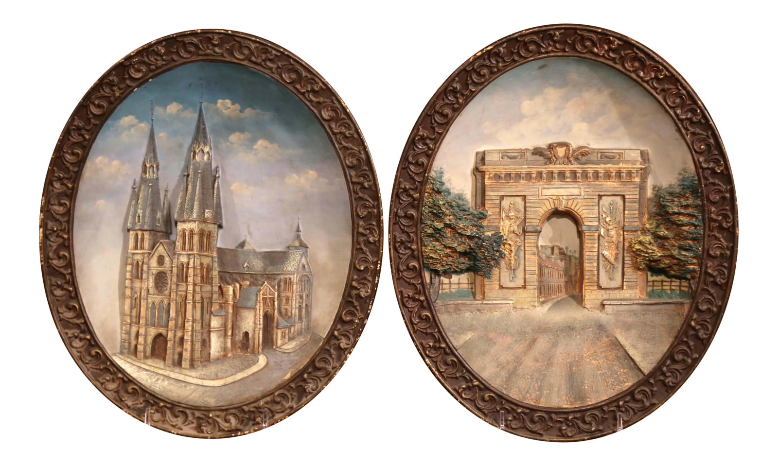 Early 20th Century French Hand-Painted Oval Decorative Wall Platters - a Pair: Bring the architectural highlights of France into your home with this pair of colorful, antique decorative earthenware wall platters. Crafted in high relief, circa 1920, the decorative, oval ceramic p