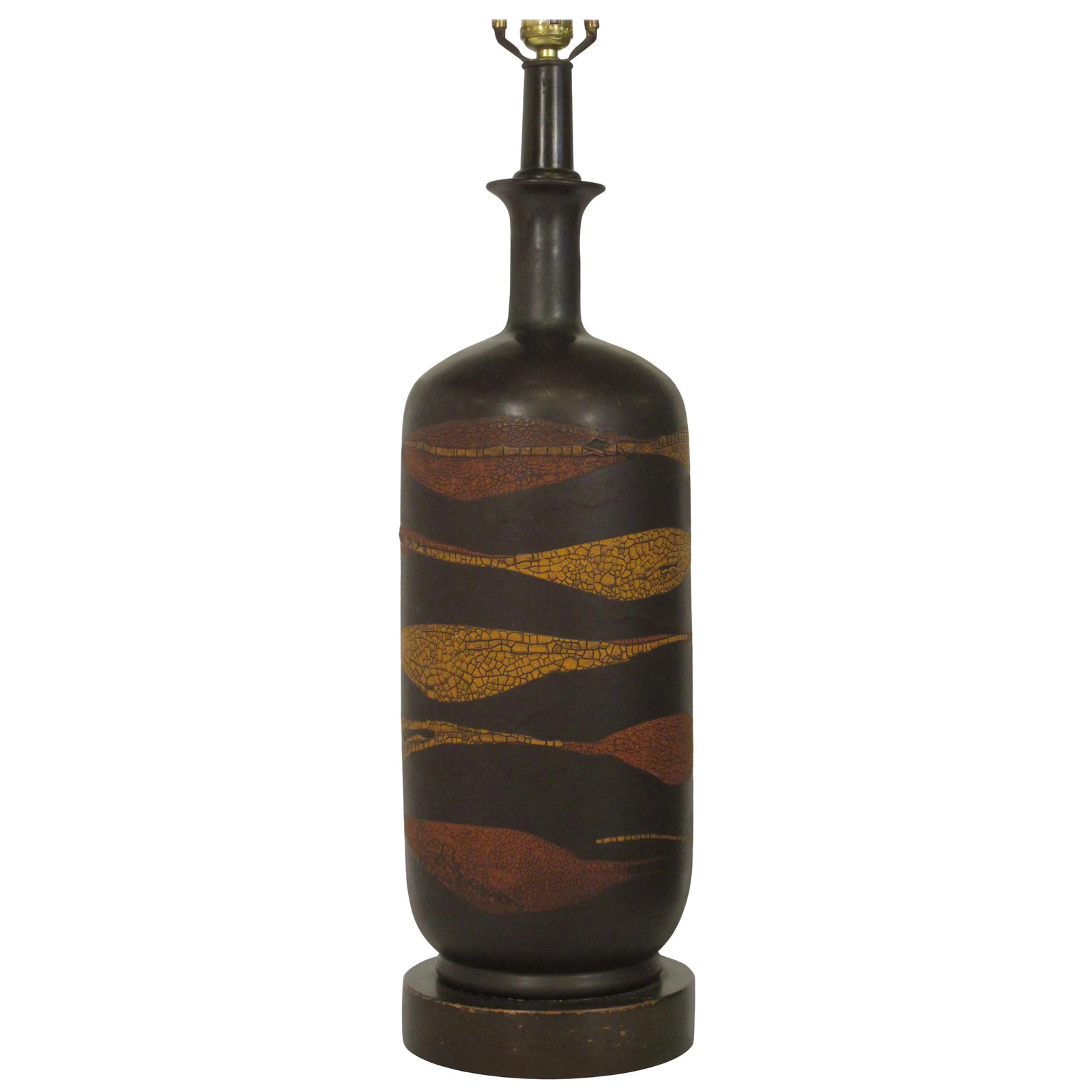 Midcentury Ceramic Snakeskin Pattern Brown Lamp on Wood Base: 1960s ceramic brown swirl lamp with snakeskin pattern on wood base. Condition: Alterations: Original Condition Unaltered Imperfections: Some Imperfections Condition Notes: Good Lamp needs rewiring.