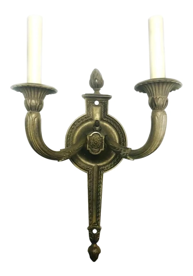 1930s Large Vintage French Empire Brass Double Arm Sconce: This Vintage French Empire Sconce would compliment any entrance way, library or hall way in an upscale estate. This Sconce is crafted of brass, and is heavy in weight. The ornate double arms are