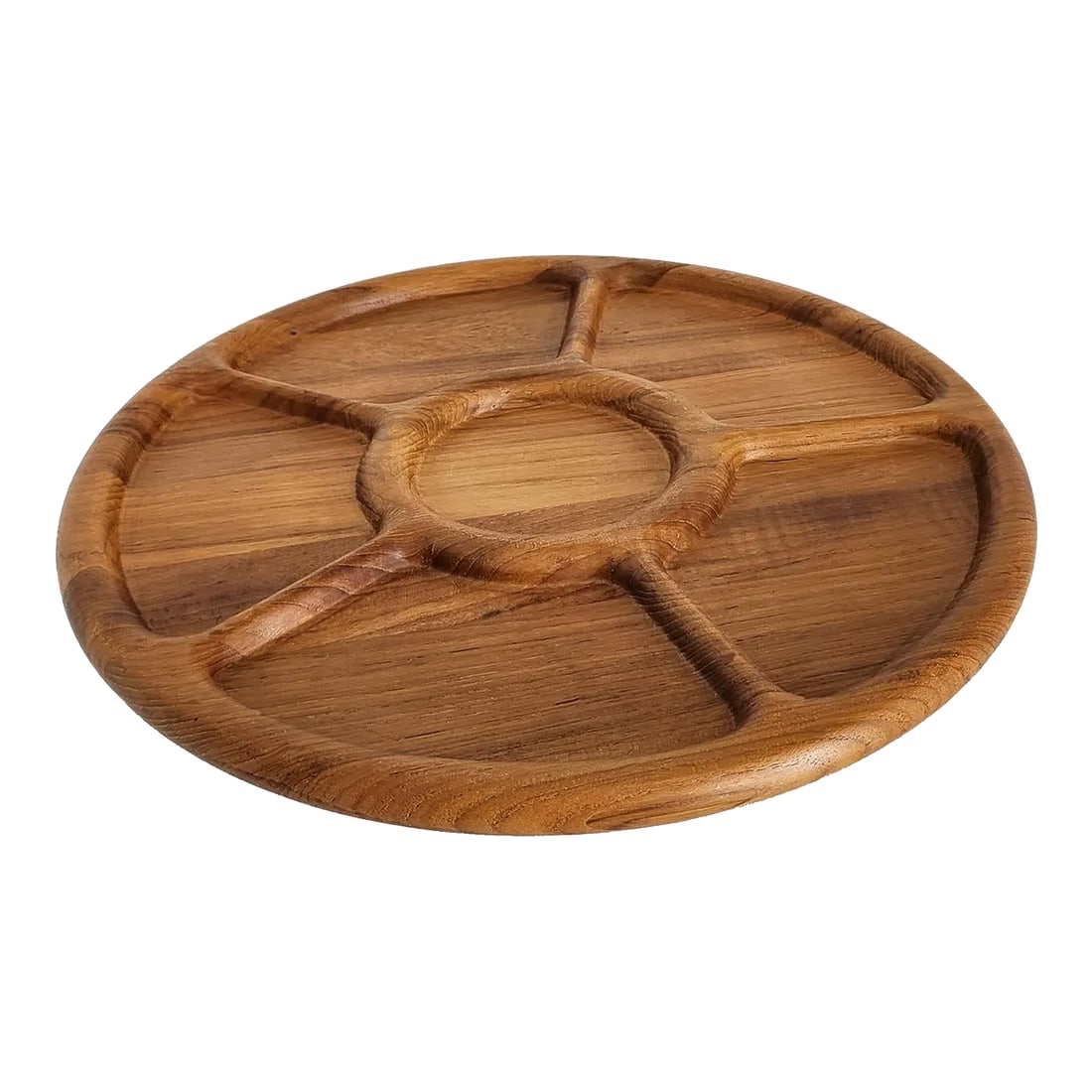 1970s Teak Wood Partitioned Lazy Susan Made for Neiman Marcus: Offered is a 1970s Teak Wood Lazy Susan, made for Neiman Marcus' Home and Design department. The partitions resemble a ship's wheel, with 5 carveouts along the edge, and a circle in the center,