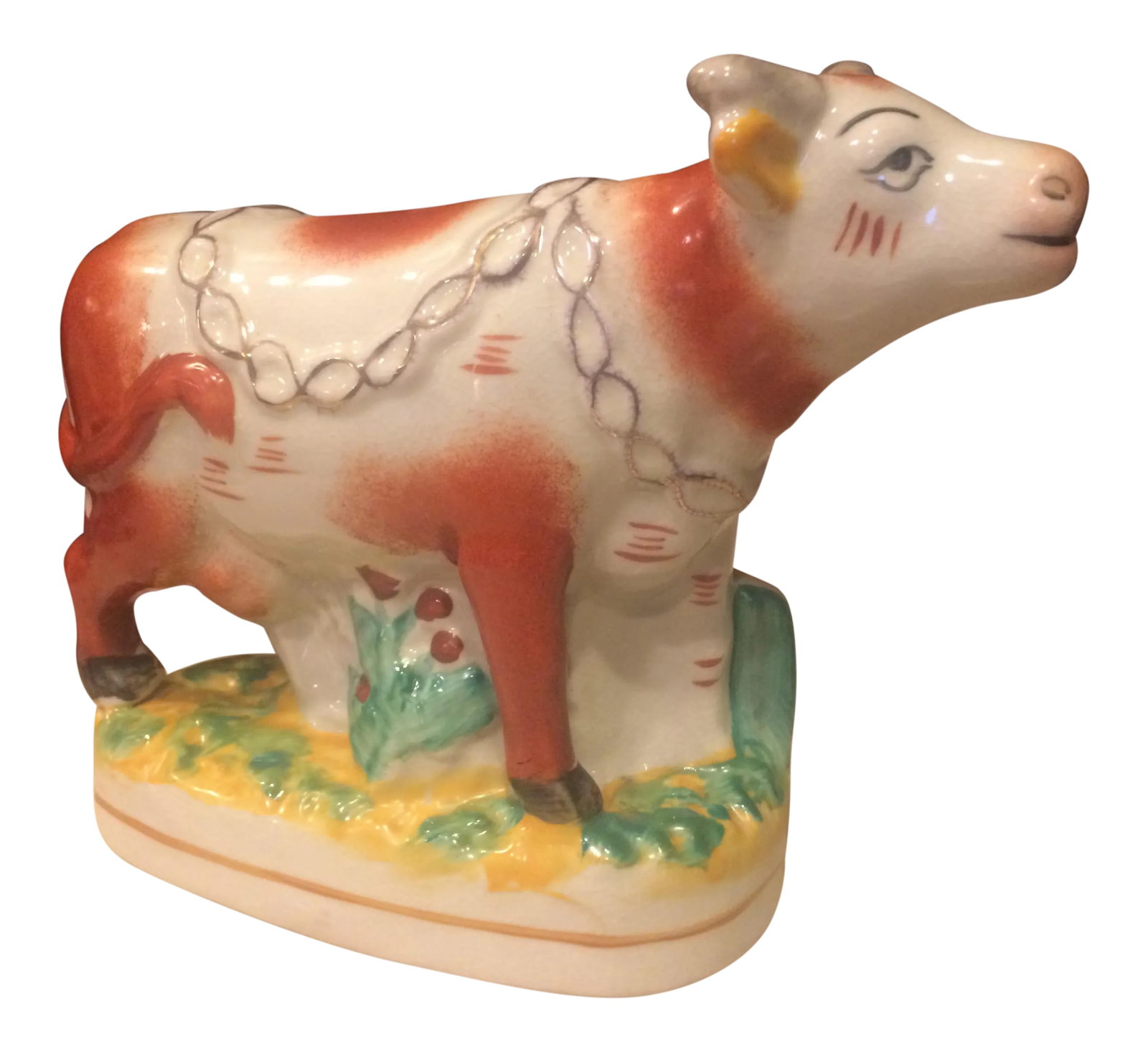 Staffordshire Style Ceramic Cow Figurine: I found it unnecessary to invest "big bucks" in authentic Staffordshire when there are so many good copies...this is one of these. One of our first homes had a cow pasture with "pet cows". Needless