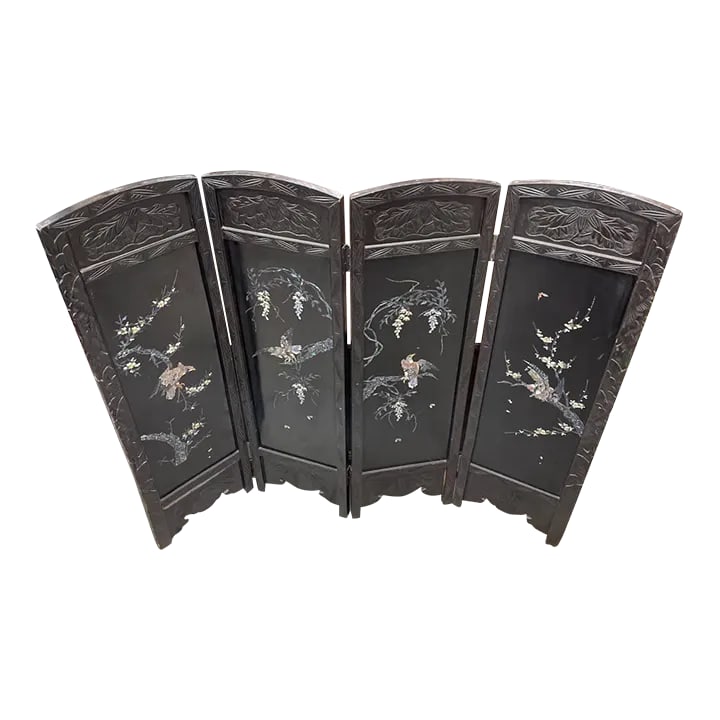 Antique Asian Four Panel Folding Screen Mother of Pearl Inlay: Available is a antique Asian Four panel Folding Screen from the early 20th century. It is fully hand carved on wood with intricate designs all made of inlayed mother of pearl. There are some signs of 