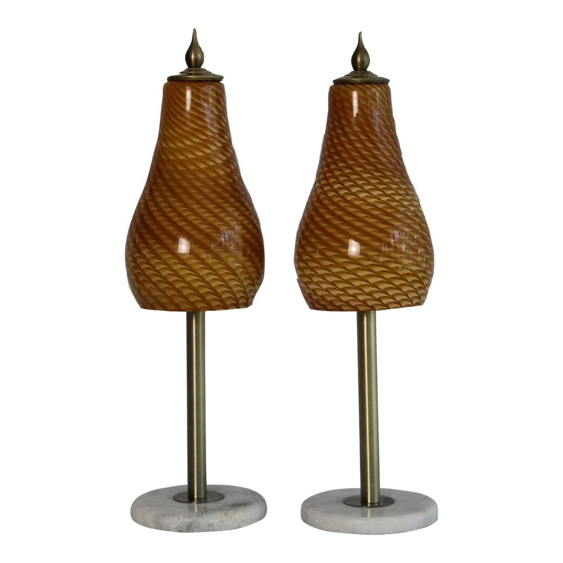 Mid 20th Century Amber Murano Style Swirl Lamps - a Pair: A pair of petite Mezza Murano style lamps. Simple sleek design. Graceful pear shape hand blown glass shades. Mounted on burnished brass with marble bases. Captures beautiful light in natural or when i