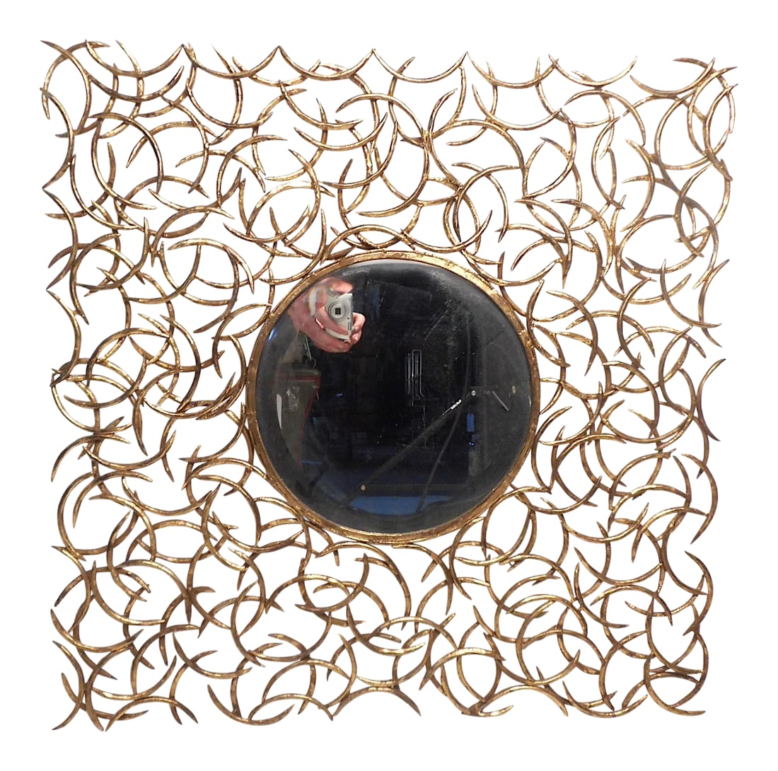 Late 20th Century Accent Mirror by Arteriors: Beautiful accent mirror by Arteriors. Small circular mirror surrounded by a decorative array of metal accents with a gold-colored finish. Great piece sure to add a lively dimension to any modern