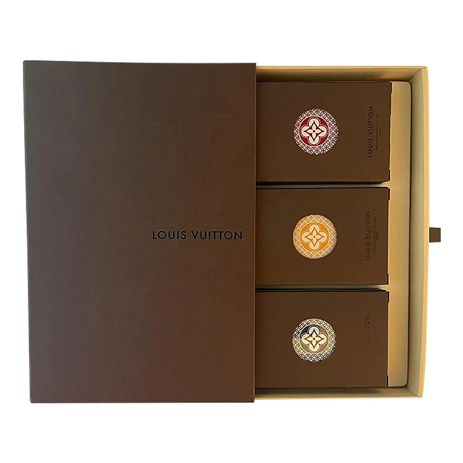 Louis Vuitton Discontinued Boxed Playing Card Decks - Set of Three: This luxury brand set is no longer available in stores. Fabulous brown Louis Vuitton storage box slides open revealing a set of three, individually-boxed playing card decks (sealed in cellophane). Eac