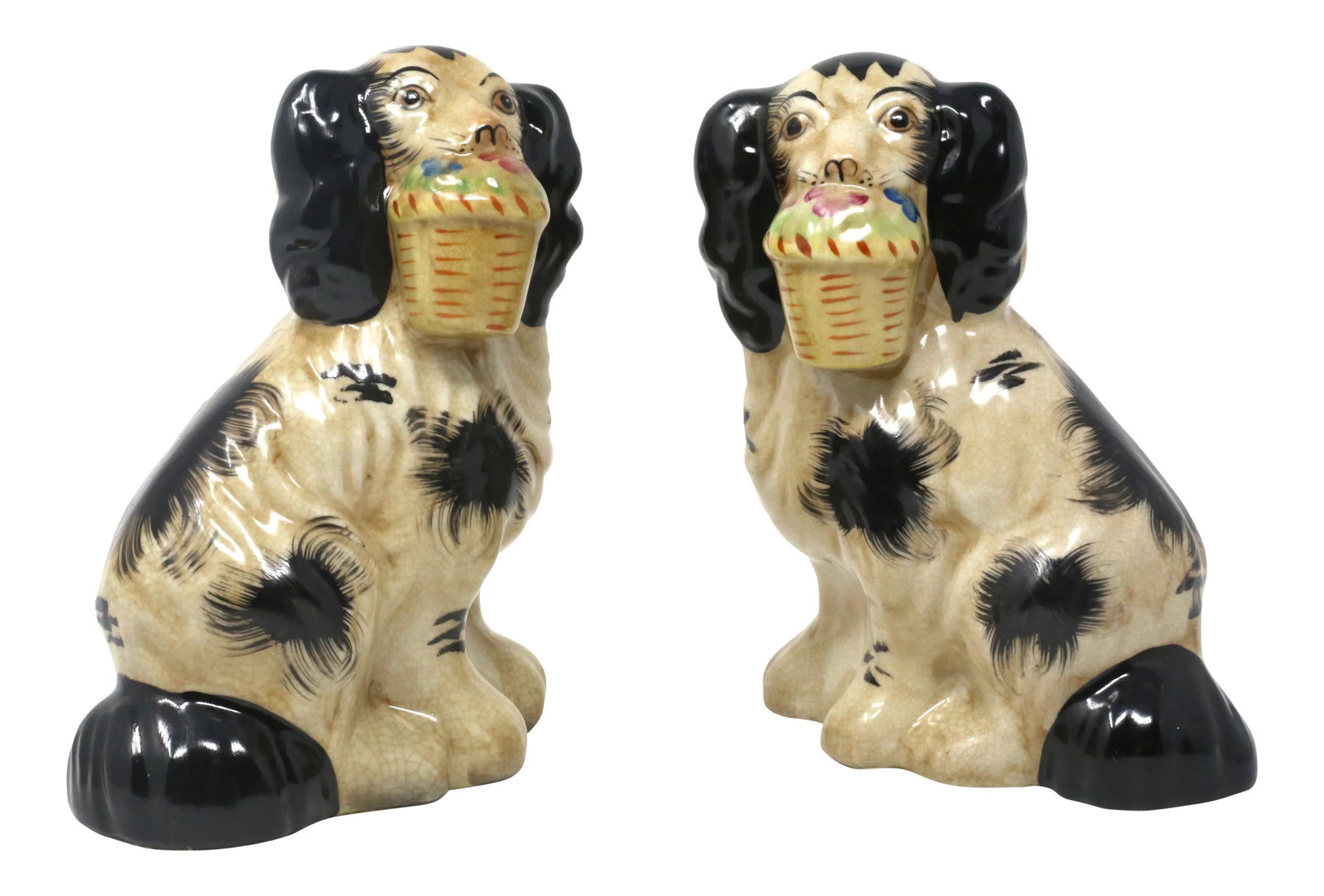Vintage Staffordshire-Style Cavalier King Spaniel Ceramic Dog Figurines - Set of 2: A set of two hand-painted ceramic figures of Cavalier King Spaniels, each posed with a basket of flowers. Excellent condition. Condition: Alterations: Original Condition Unaltered Imperfections: Some