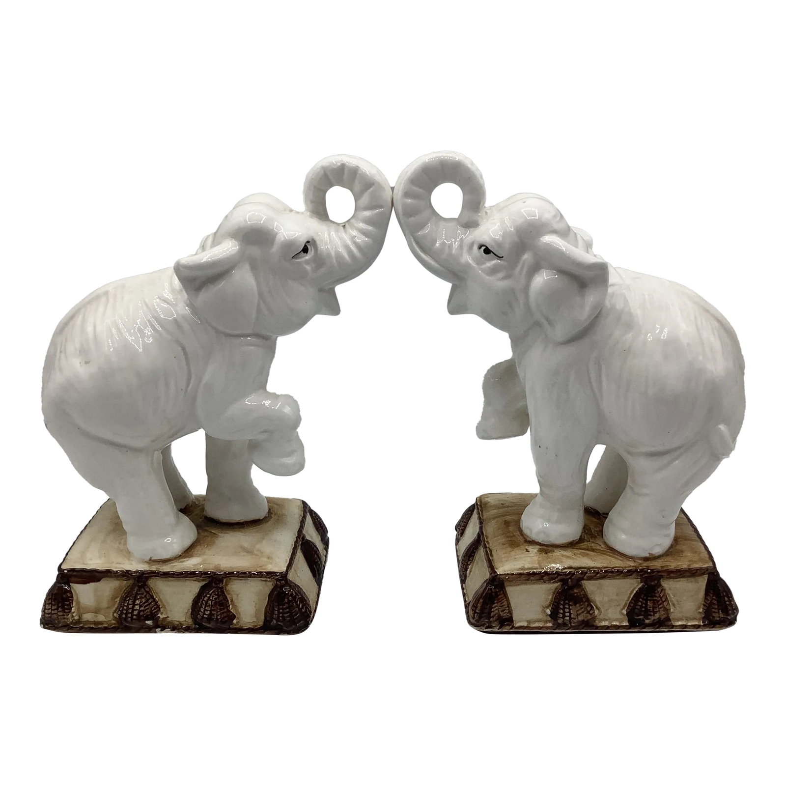 Vintage Fitz and Floyd Ceramic Elephant Bookends: A fabulous pair of 80s Fitz and Floyd semi-standing elephant on decorative stands bookends. They are both beautiful and striking and are neutral enough to go with any bookcase. They are hand painted
