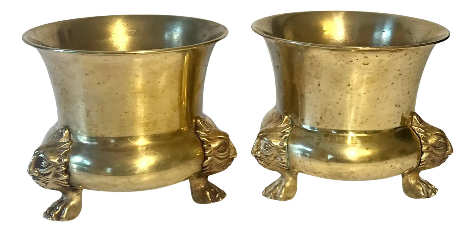 Pair of Brass Planters or Jardinieres with Lion Paw Feet: A wonderful pair of brass planters jardinieres - a unique shape and size at 6" in diameter, with lion feet. The pair are very versatile as they can be great centerpieces, flanking a fireplace mantle,