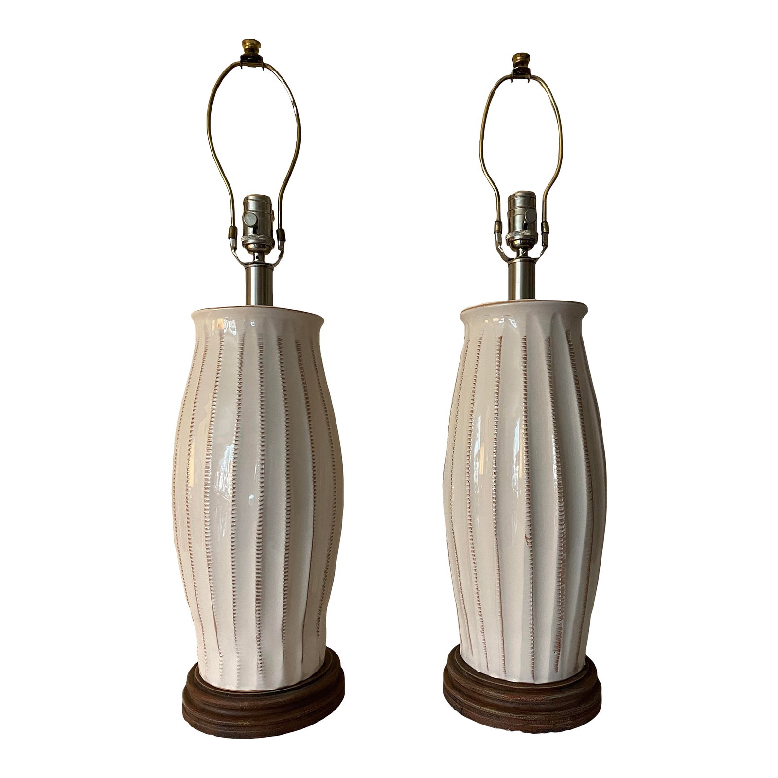 Vietri Italian Ceramic Table Lamps - a Pair: Crafted and painted by hand, this elegant pair of Vietri lamps are presented in creamy ivory ceramic with antiqued gold accents. Excellent condition. Measures 23" to top of light socket. Condition: Al